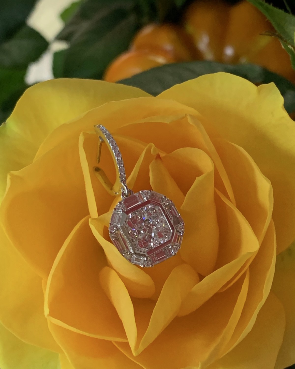 Second view of the cushion cluster diamond pendant in a yellow rose, from slightly above