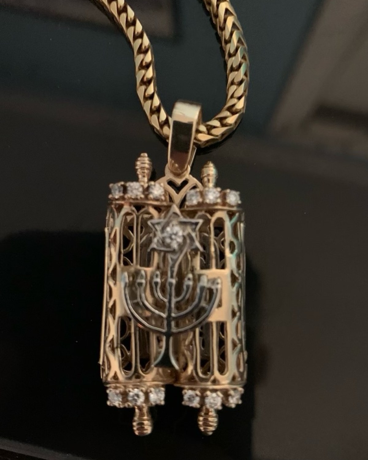 Custom gold Torah scroll pendant with a diamond Star of David and openwork menorah, on a franco chain